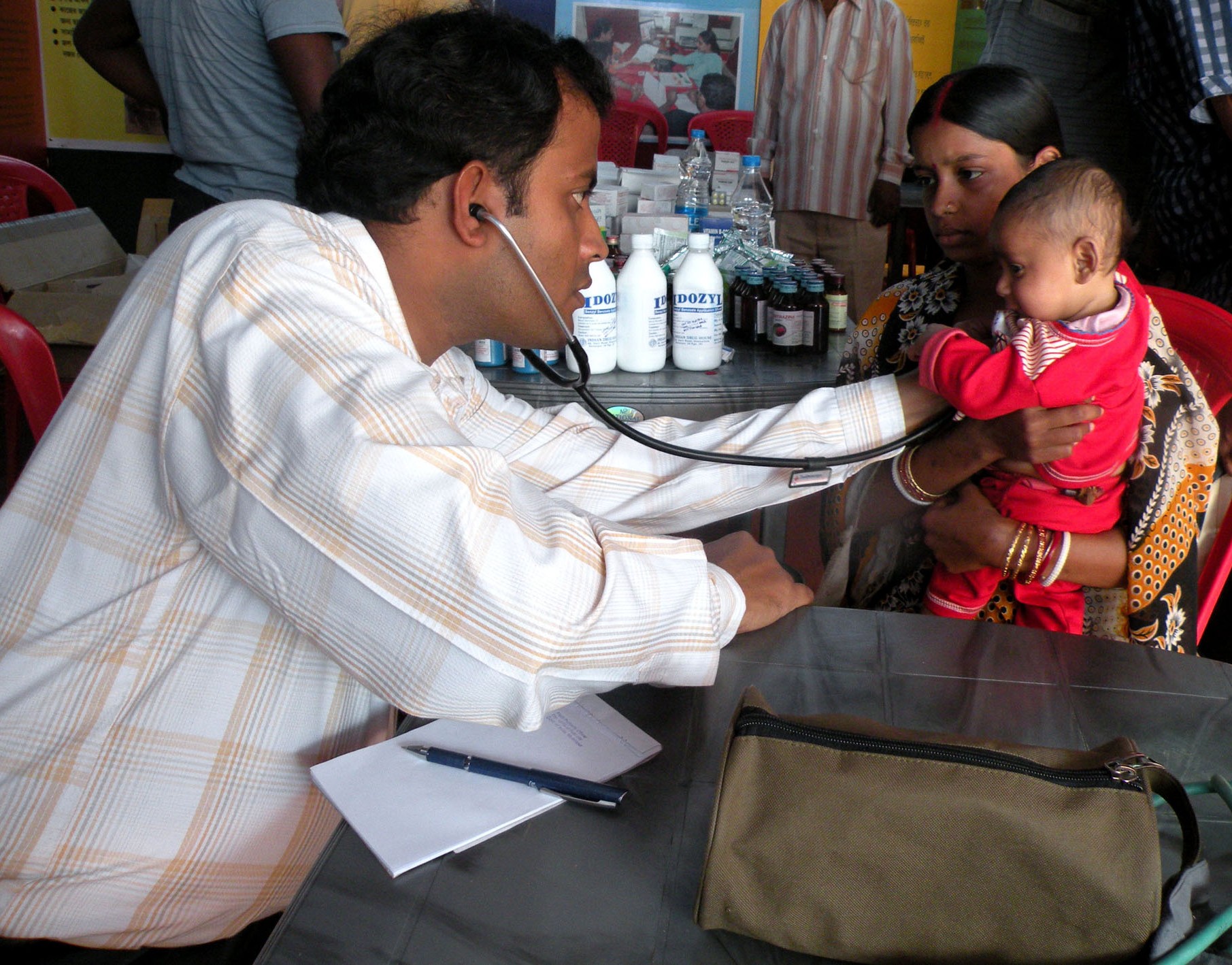 Doctor consulting with elderly patient